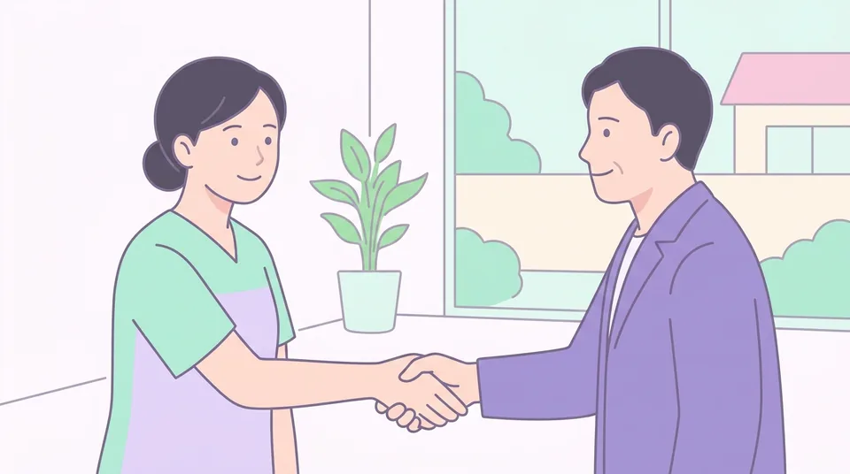訪問看護ステーションの看護師とケアマネジャーが握手する様子